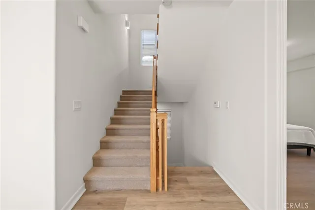 a spacious bedroom with a large bed and a fireplace