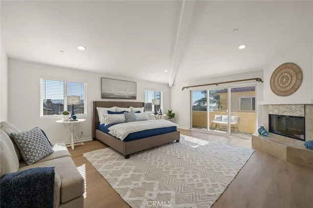 a spacious bedroom with a bed and a large window