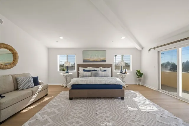 a spacious bedroom with a large bed and a couch