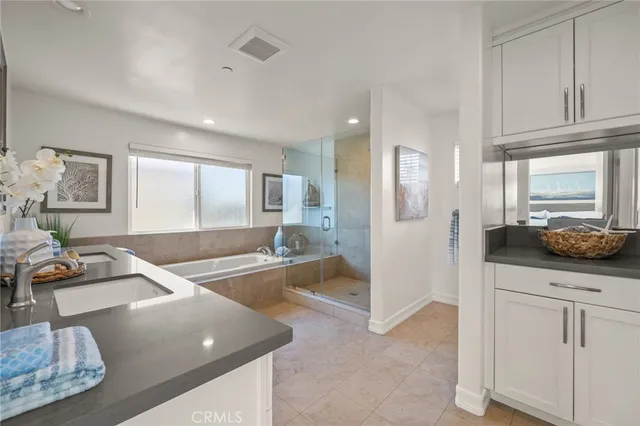 a large bedroom with a large bed and a large window