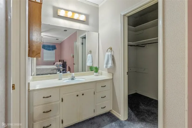 a bathroom with a double vanity sink and mirror