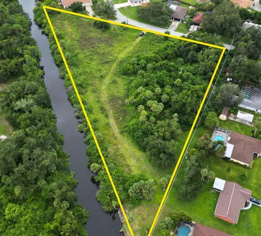an aerial view of a golf course with street view