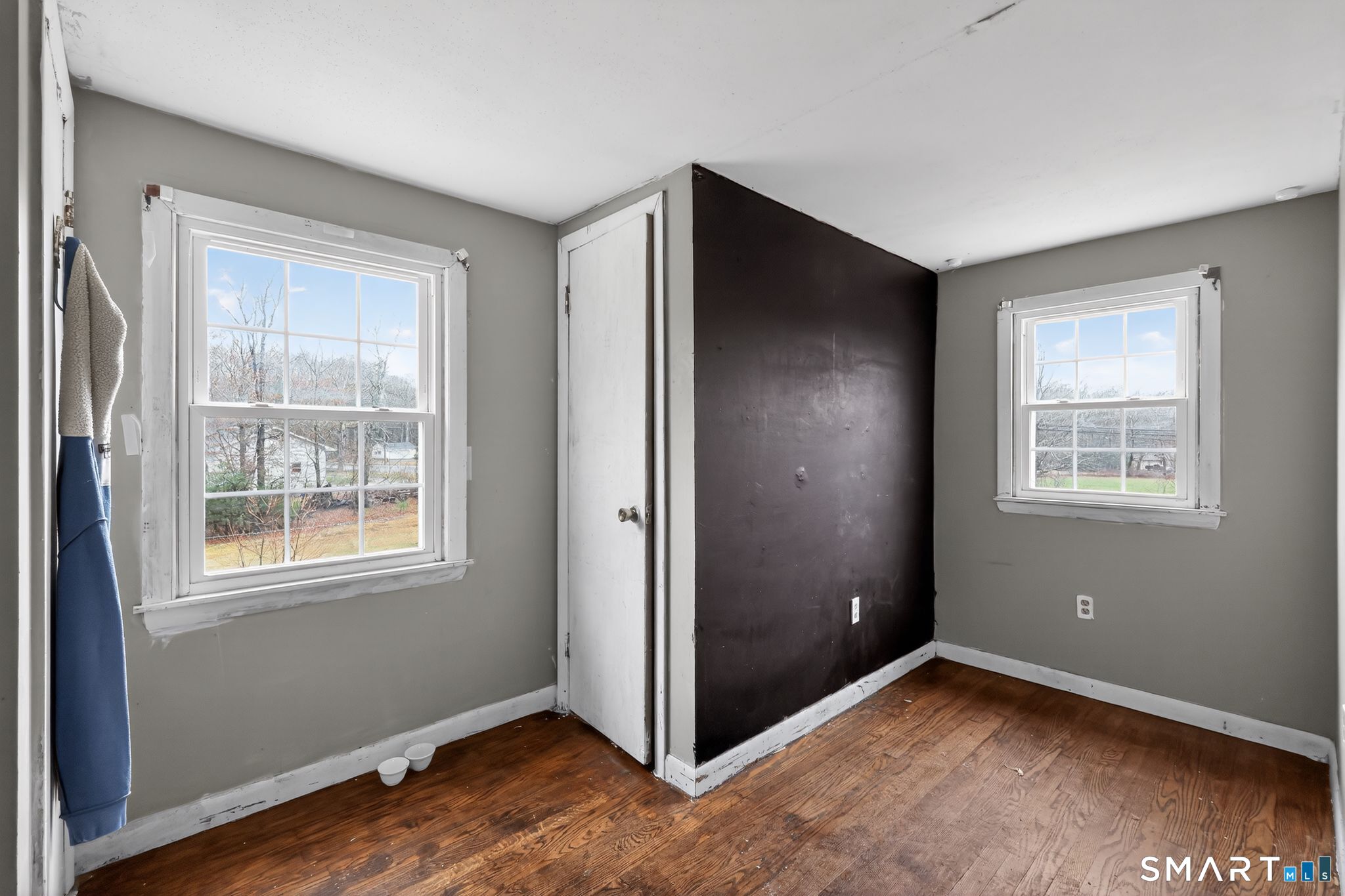 172 Bailey Hill Road Killingly, CT 06239 - Photo 12 of 35 an empty room with windows and closet
