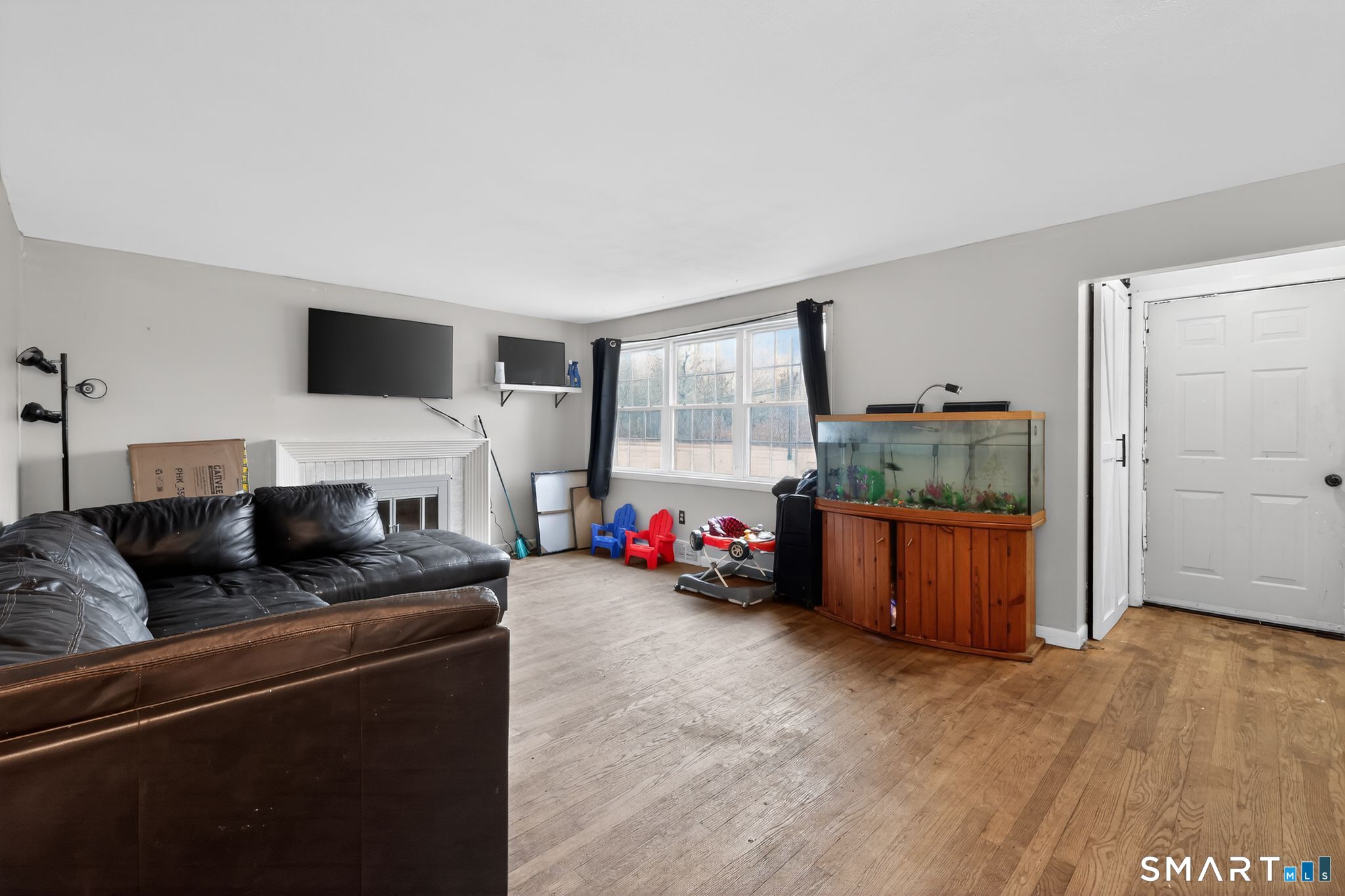 172 Bailey Hill Road Killingly, CT 06239 - Photo 5 of 35 a living room with furniture and a flat screen tv