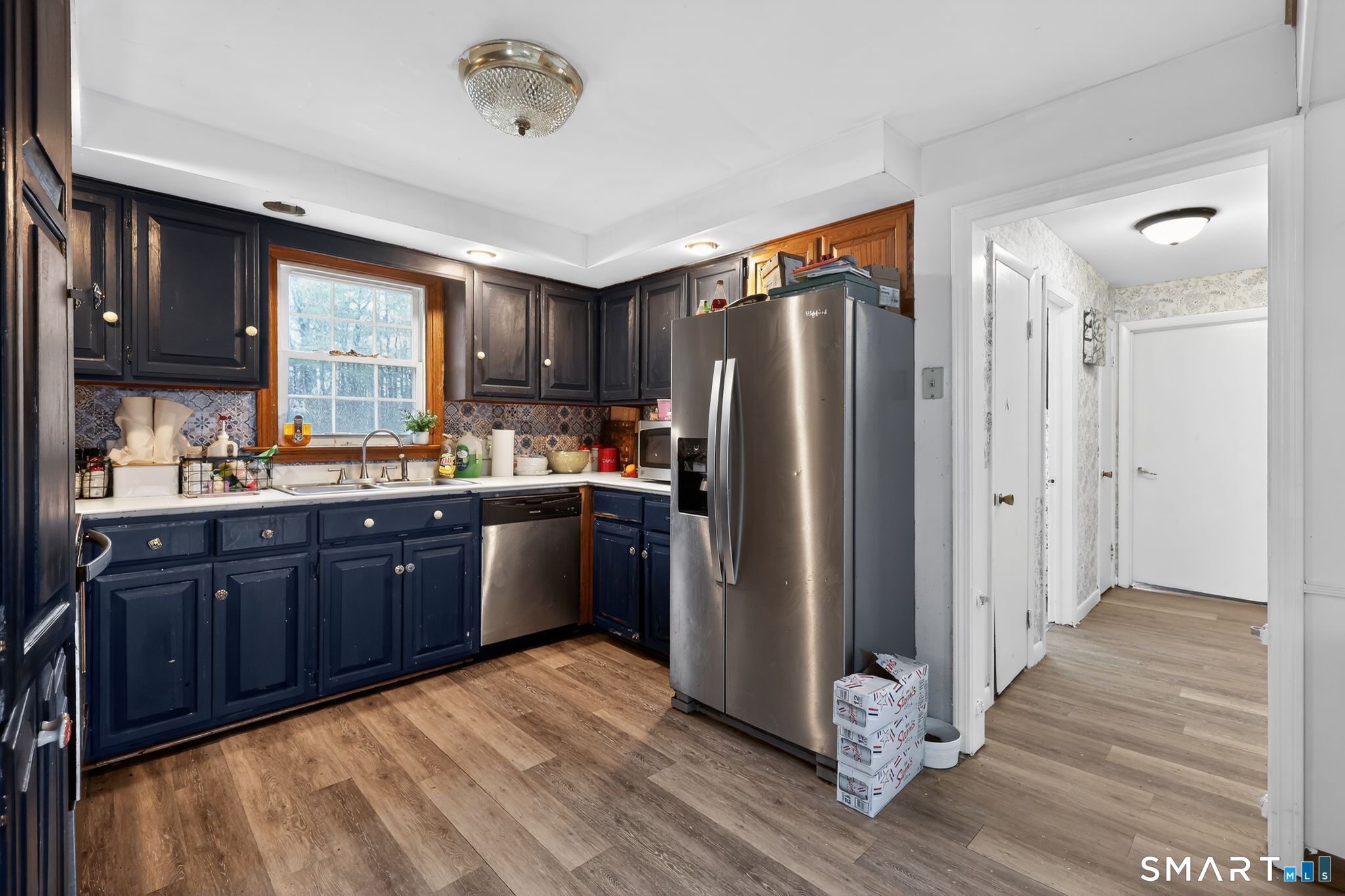 172 Bailey Hill Road Killingly, CT 06239 - Photo 9 of 35 a kitchen with stainless steel appliances granite countertop a refrigerator a sink and wooden cabinets