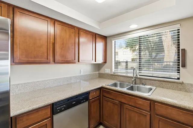 a kitchen with a sink and cabinets