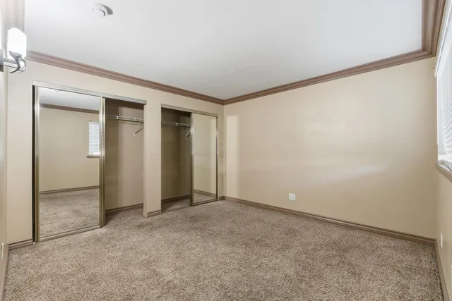 an empty room with closet area