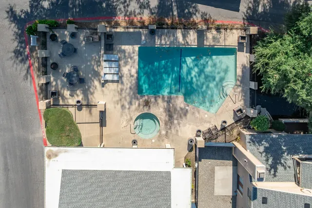 an aerial view of a house with outdoor space