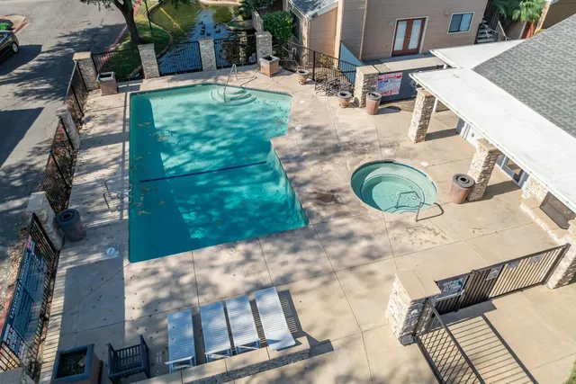 a view of a backyard with sitting area