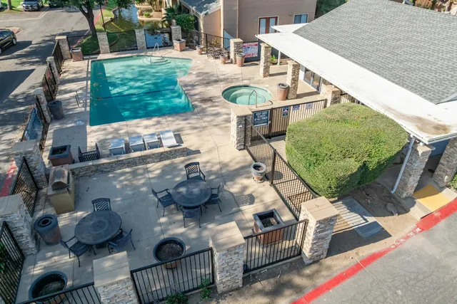 a terrace with outdoor seating and city view