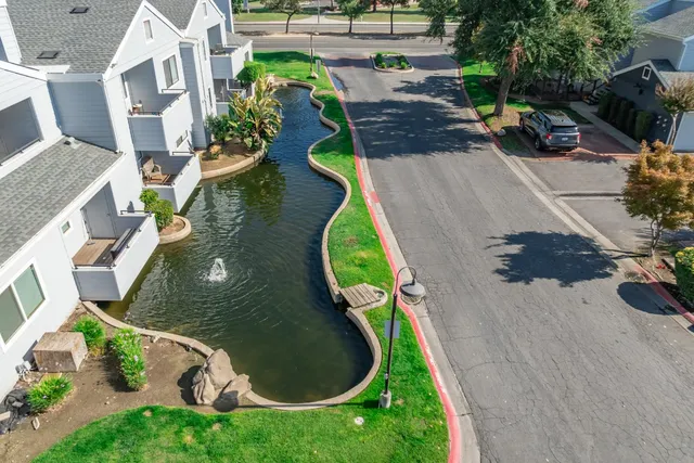 an aerial view of a house with a swimming pool
