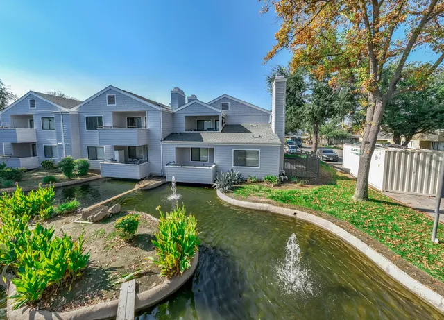 a house with swimming pool in front of it
