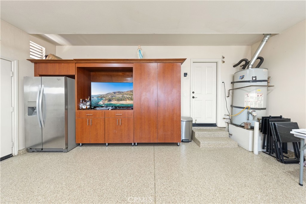 10140 Jacaranda Court Rancho Cucamonga, CA 91737 - Photo 42 of 70 Epoxy flooring + built in shelves inside the garage