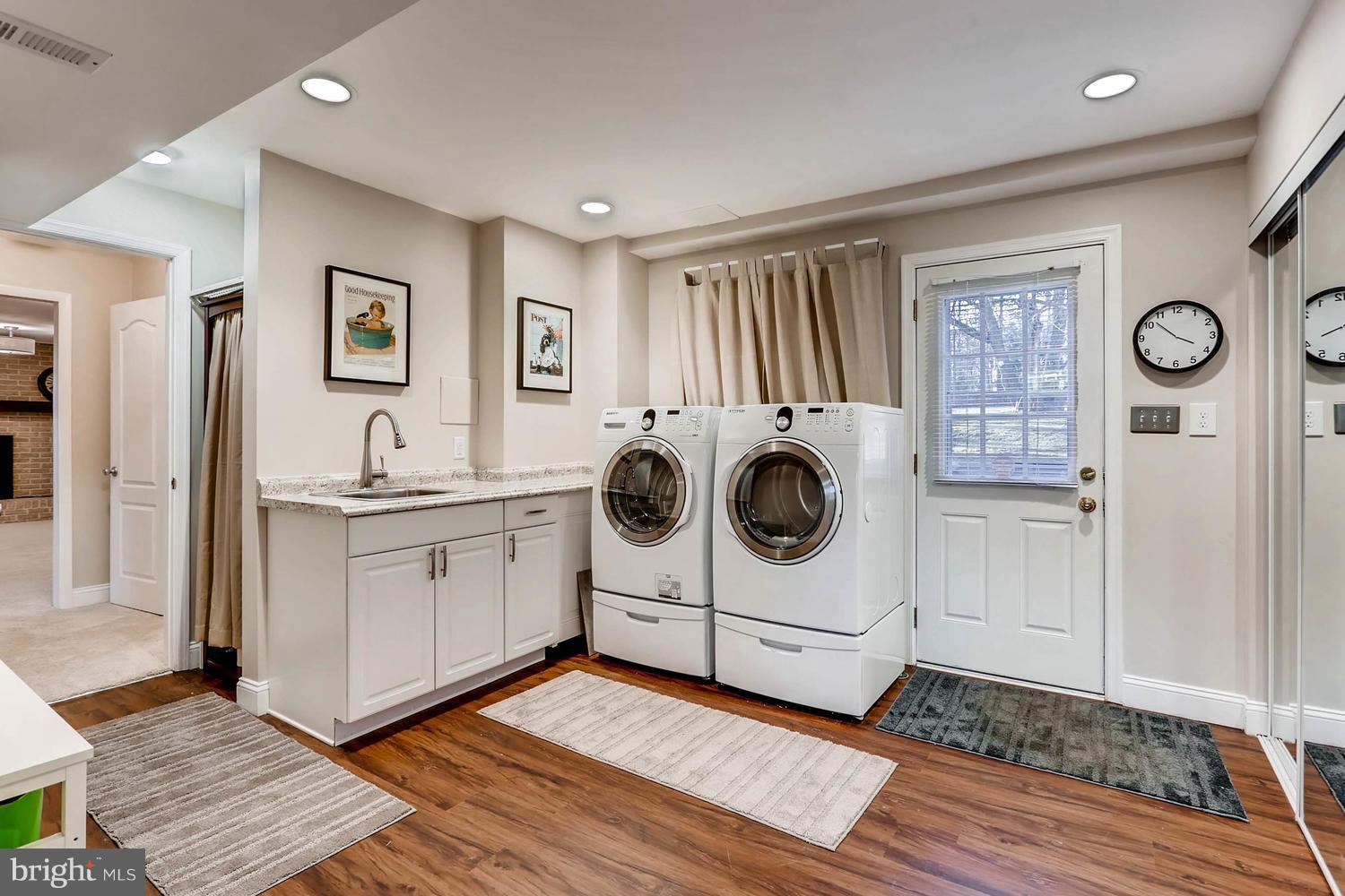 14912 Old York Road Phoenix, MD 21131 - Photo 24 of 27 LAUNDRY RM W/ SS SINK, FRONT LOADERS, CABINETS