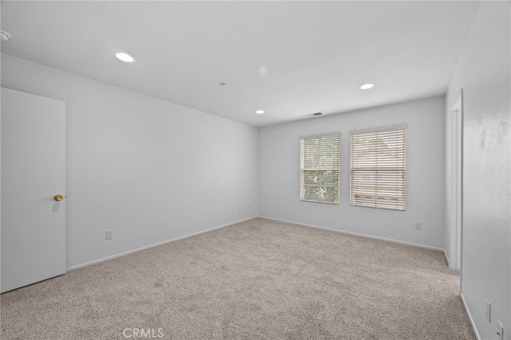 7353 Ellena West, Unit 112 Rancho Cucamonga, CA 91730 - Photo 16 of 36 a view of an empty room with a window