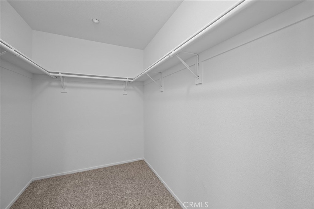 7353 Ellena West, Unit 112 Rancho Cucamonga, CA 91730 - Photo 19 of 36 a view of an empty walk in closet