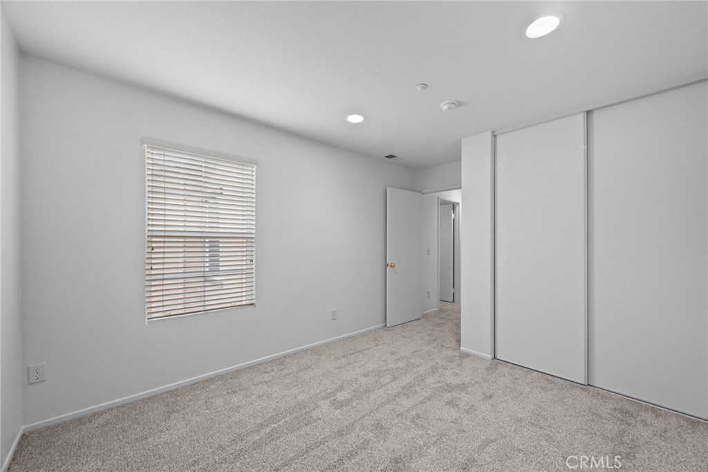 7353 Ellena West, Unit 112 Rancho Cucamonga, CA 91730 - Photo 23 of 36 a view of an empty room with a window