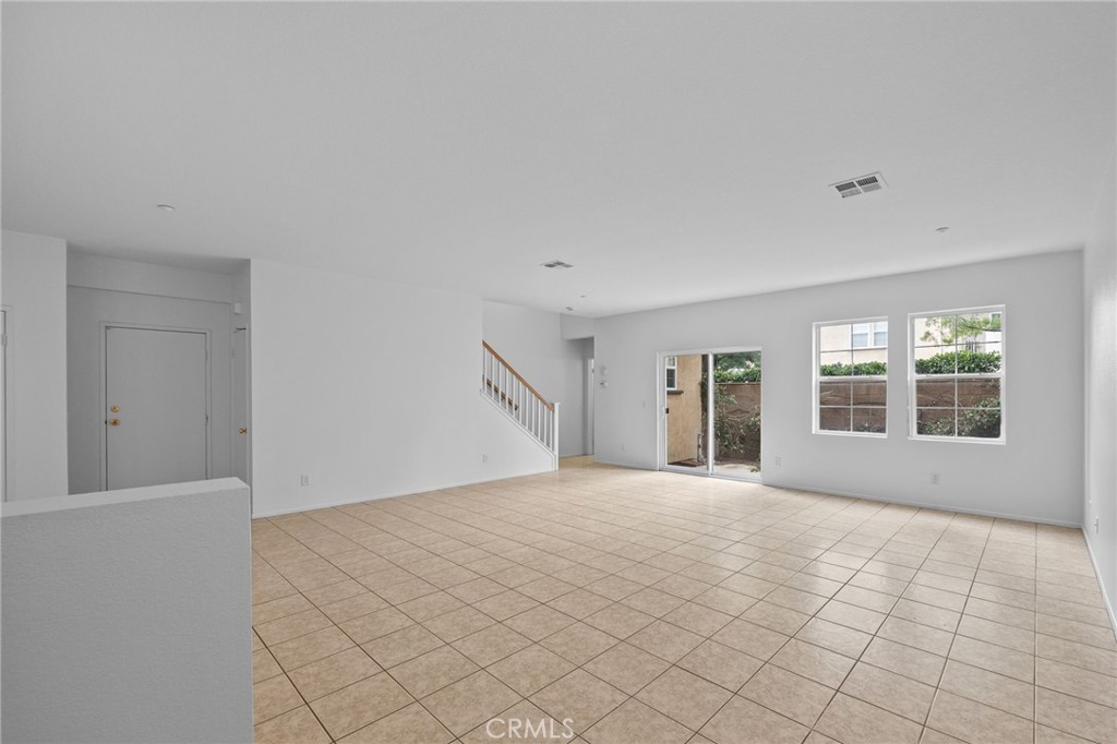 7353 Ellena West, Unit 112 Rancho Cucamonga, CA 91730 - Photo 5 of 36 a view of an empty room with a window