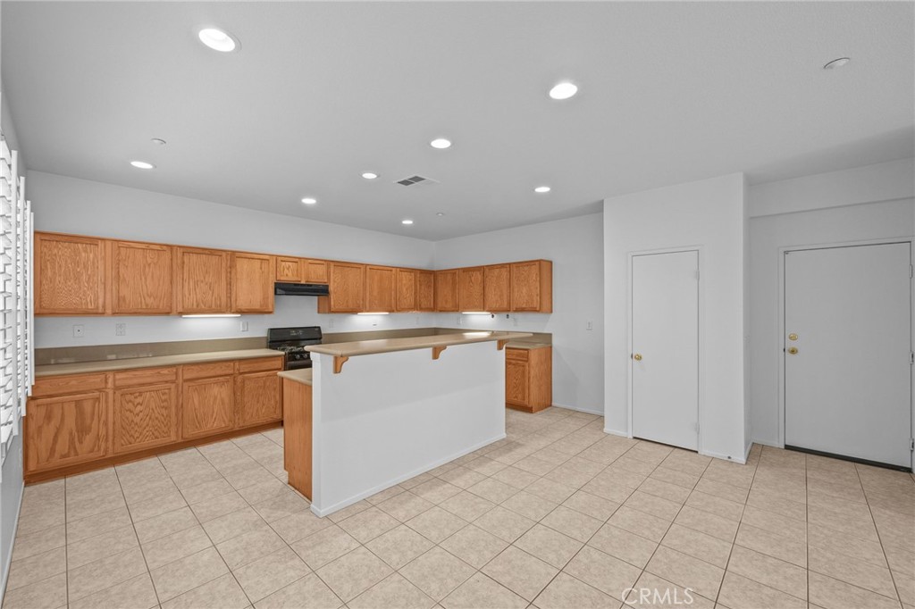 7353 Ellena West, Unit 112 Rancho Cucamonga, CA 91730 - Photo 8 of 36 a kitchen with a sink and cabinets