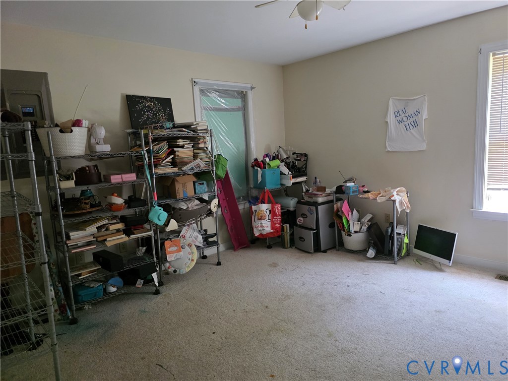 3161 Dorrell Road Aylett, VA 23009 - Photo 19 of 41 a view of a garage with a bike and a car