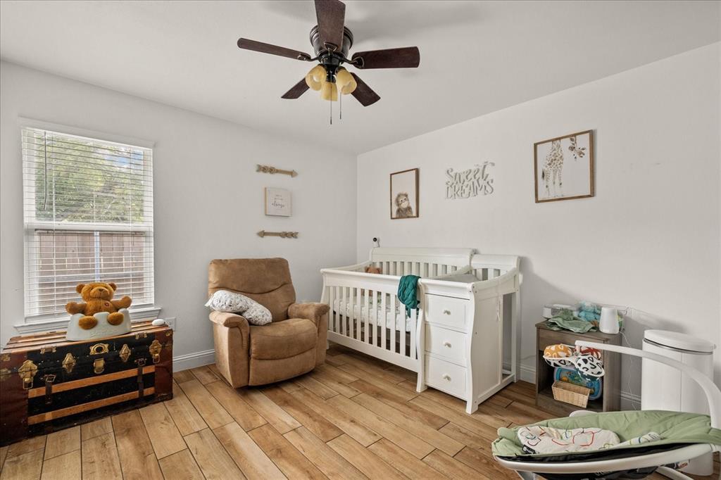 408 South Cedar Street Leonard, TX 75452 - Photo 16 of 22 a living room with furniture and a wooden floor