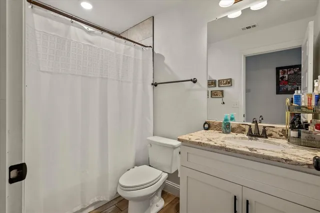 a bedroom with a bed and a desk