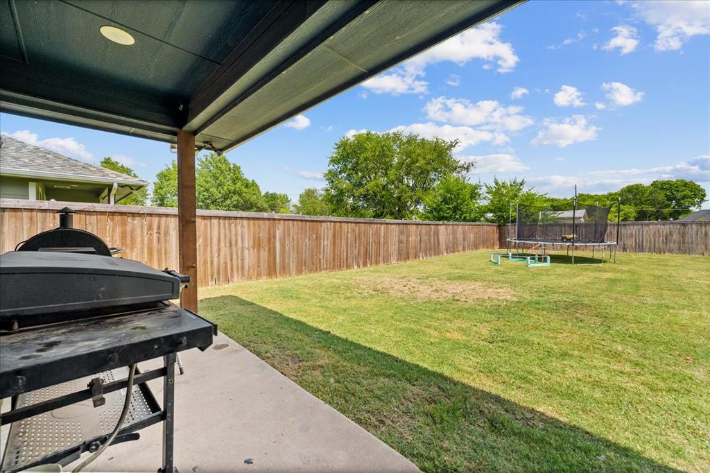 408 South Cedar Street Leonard, TX 75452 - Photo 20 of 22 a view of a backyard with a garden