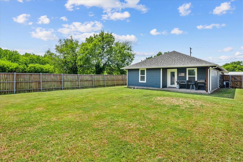 408 South Cedar Street Leonard, TX 75452 - Photo 22 of 22 a front view of a house with a garden