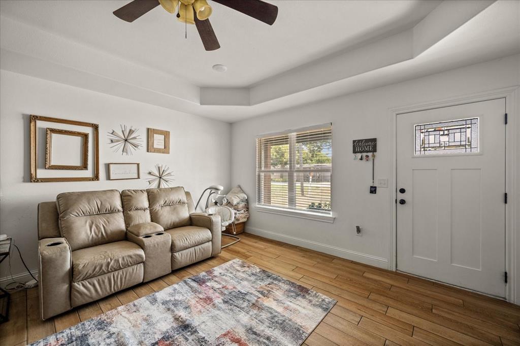 408 South Cedar Street Leonard, TX 75452 - Photo 4 of 22 a living room with furniture and a rug