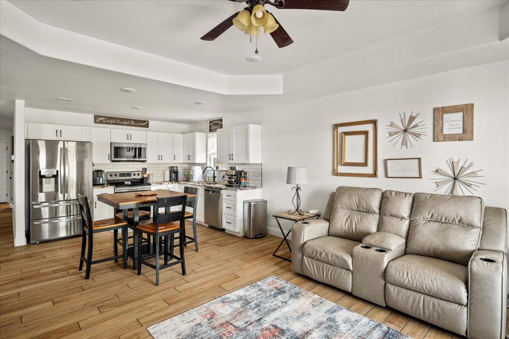 408 South Cedar Street Leonard, TX 75452 - Photo 6 of 22 a living room with furniture kitchen view and a dining table