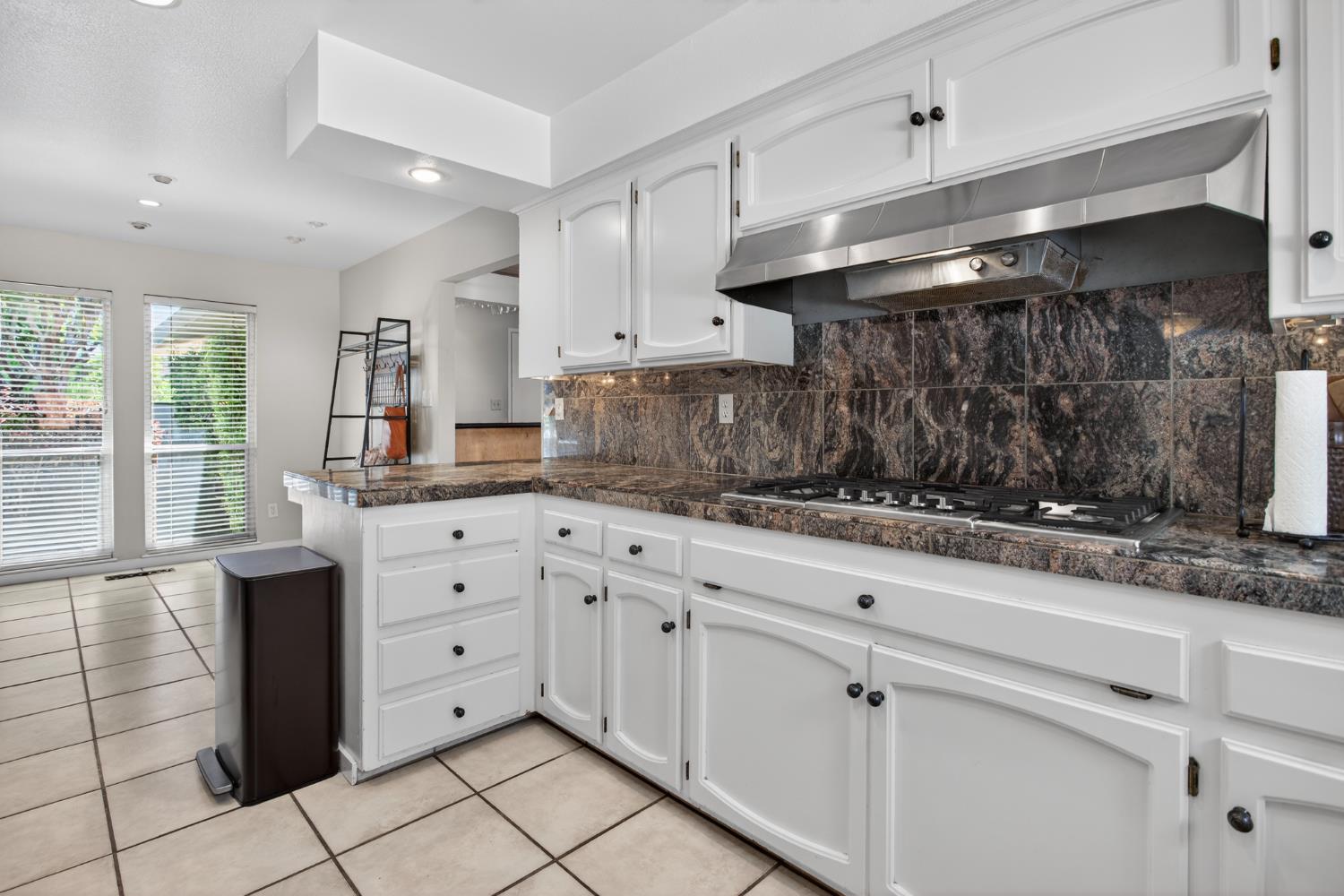 1909 Chelwood Way Modesto, CA 95355 - Photo 16 of 44 a kitchen with granite countertop white cabinets and stainless steel appliances