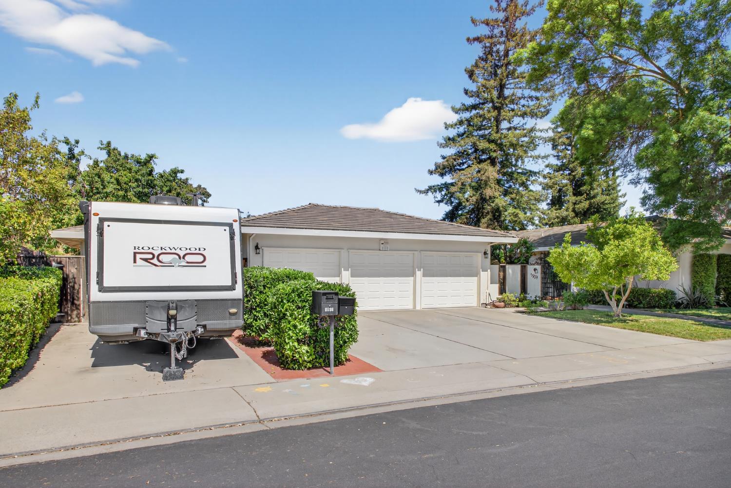 1909 Chelwood Way Modesto, CA 95355 - Photo 2 of 44 a view of a house with a yard and table and chairs