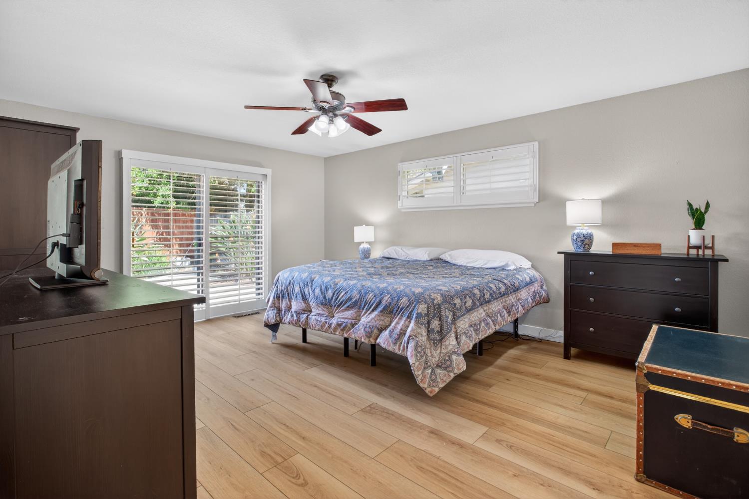 1909 Chelwood Way Modesto, CA 95355 - Photo 28 of 44 a bedroom with a bed and wooden floor
