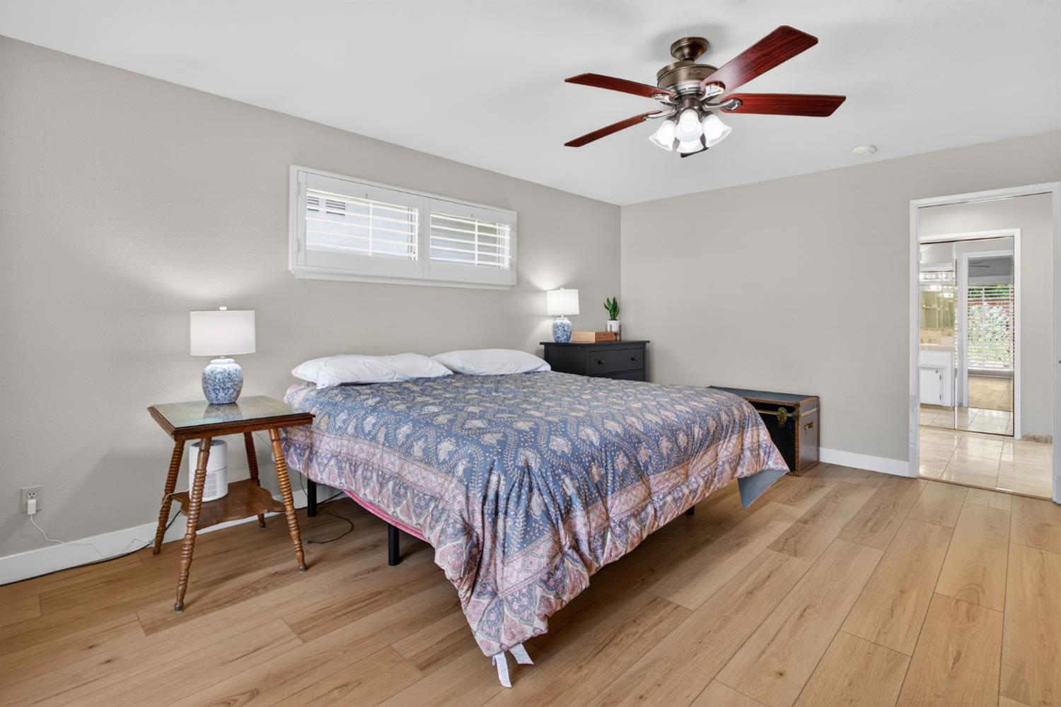 1909 Chelwood Way Modesto, CA 95355 - Photo 29 of 44 a bedroom with a bed and a chandelier