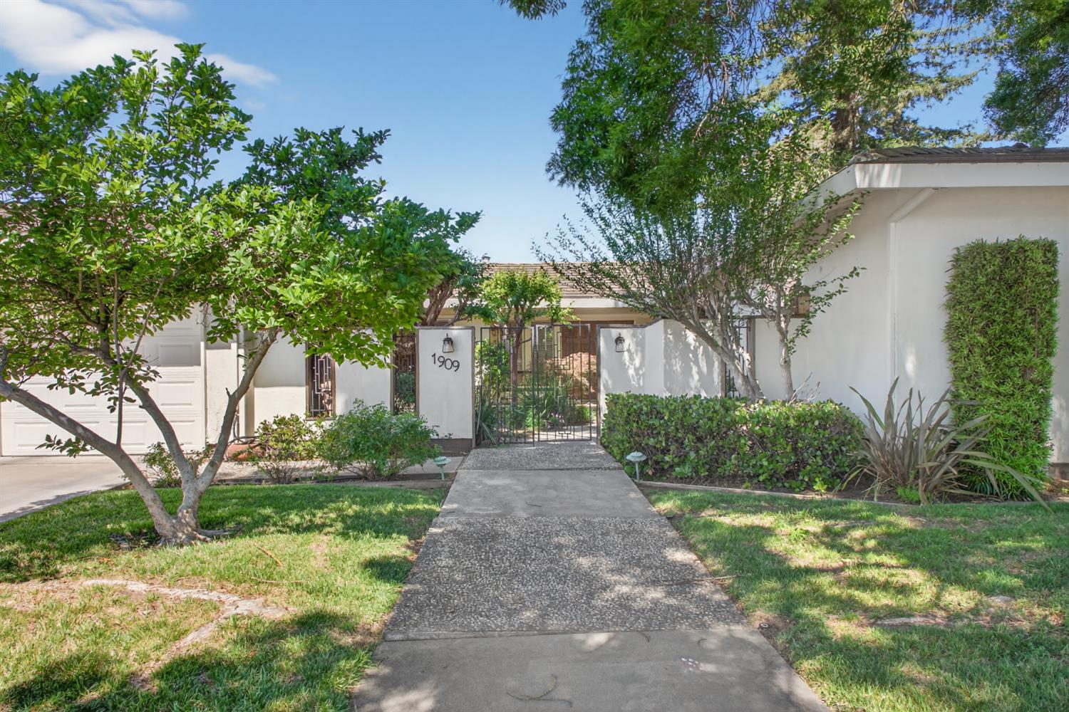 1909 Chelwood Way Modesto, CA 95355 - Photo 3 of 44 a front view of a house with garden
