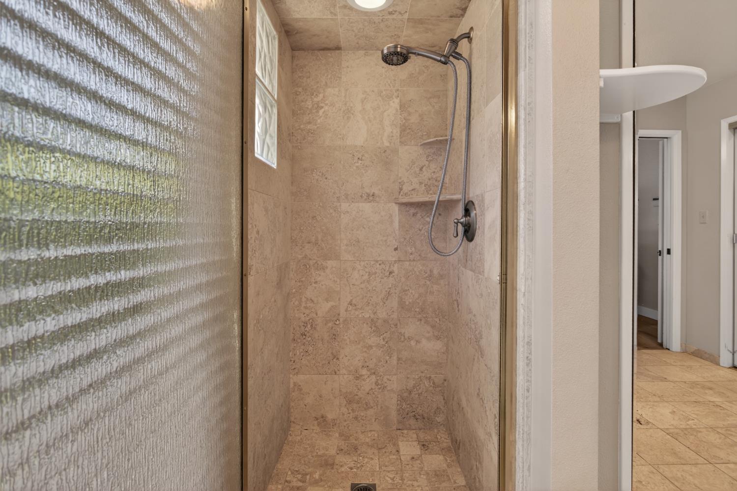 1909 Chelwood Way Modesto, CA 95355 - Photo 32 of 44 a bathroom with a shower