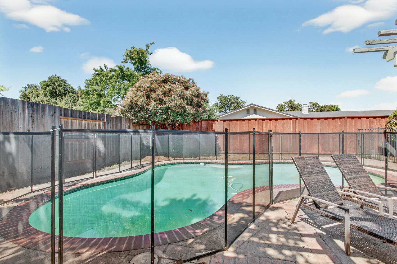 1909 Chelwood Way Modesto, CA 95355 - Photo 35 of 44 a view of a chair and table in the outdoor space