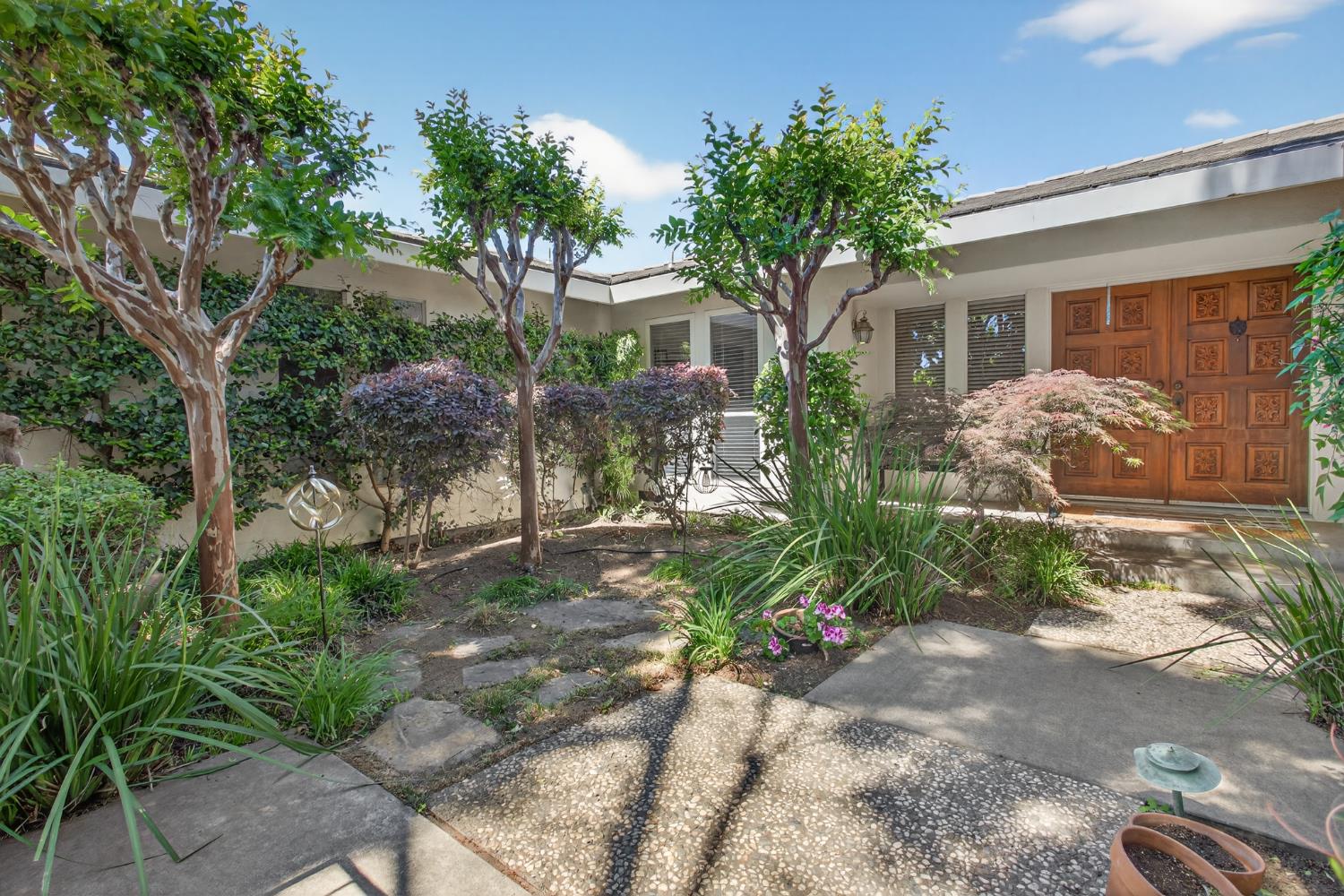 1909 Chelwood Way Modesto, CA 95355 - Photo 6 of 44 a front view of a house with garden