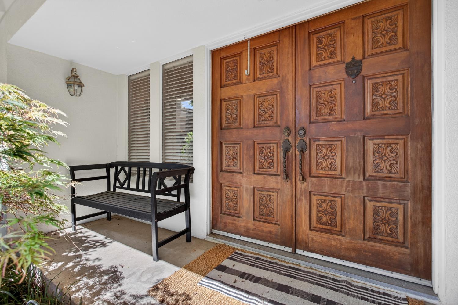 1909 Chelwood Way Modesto, CA 95355 - Photo 7 of 44 a view of a porch with a bench