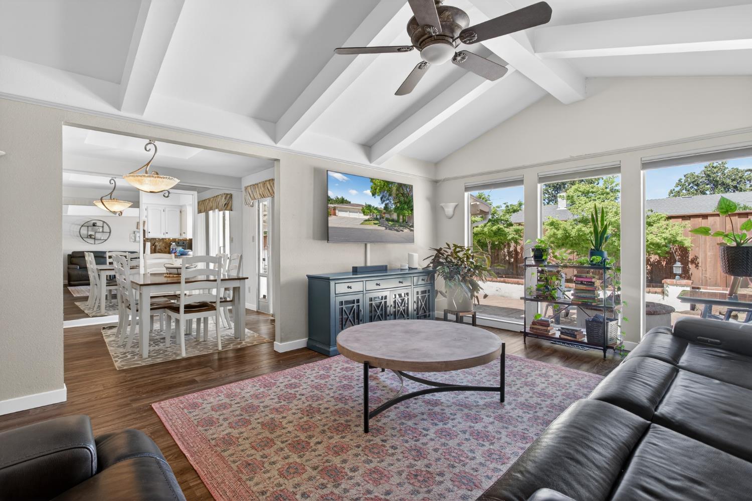 1909 Chelwood Way Modesto, CA 95355 - Photo 10 of 44 a living room with furniture a rug potted plant and a large window