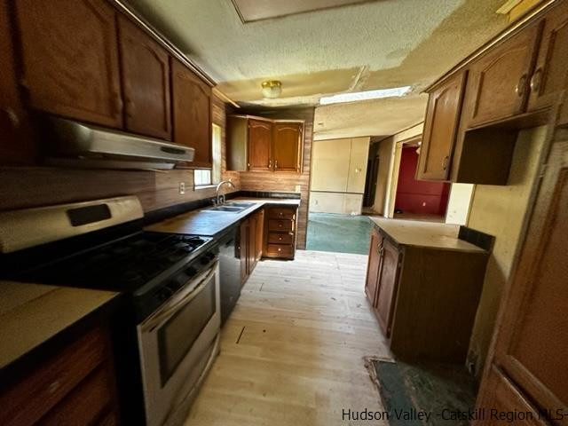 16 Stewart Road Cairo, NY 12470 - Photo 13 of 22 a kitchen with granite countertop stainless steel appliances and wooden cabinets