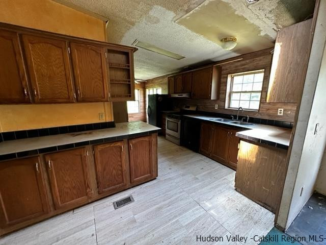 16 Stewart Road Cairo, NY 12470 - Photo 9 of 22 a kitchen with wooden cabinets and a sink