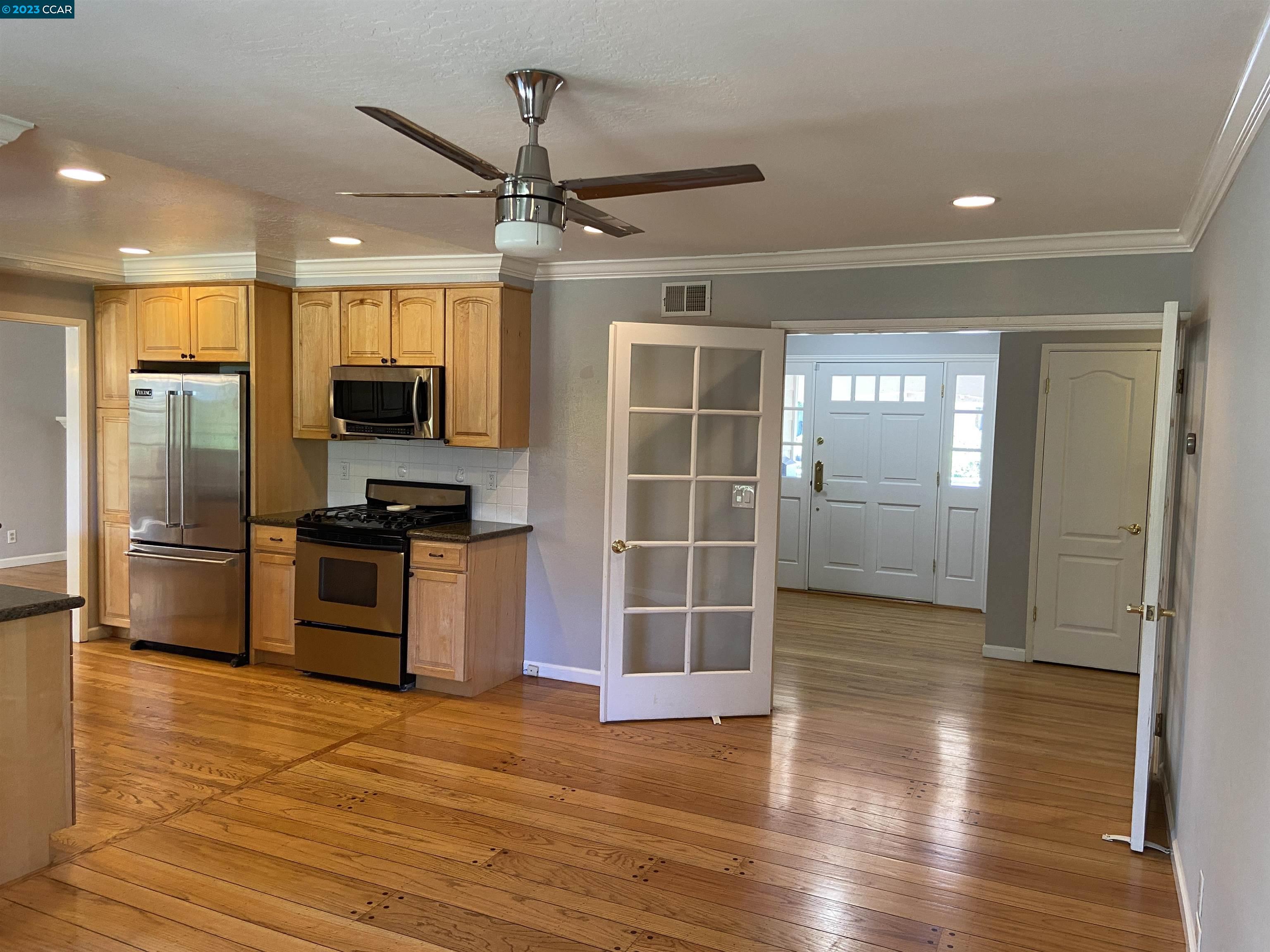 2202 Cascade Drive Walnut Creek, CA 94598 - Photo 11 of 23 a kitchen with stainless steel appliances a refrigerator and a stove top oven
