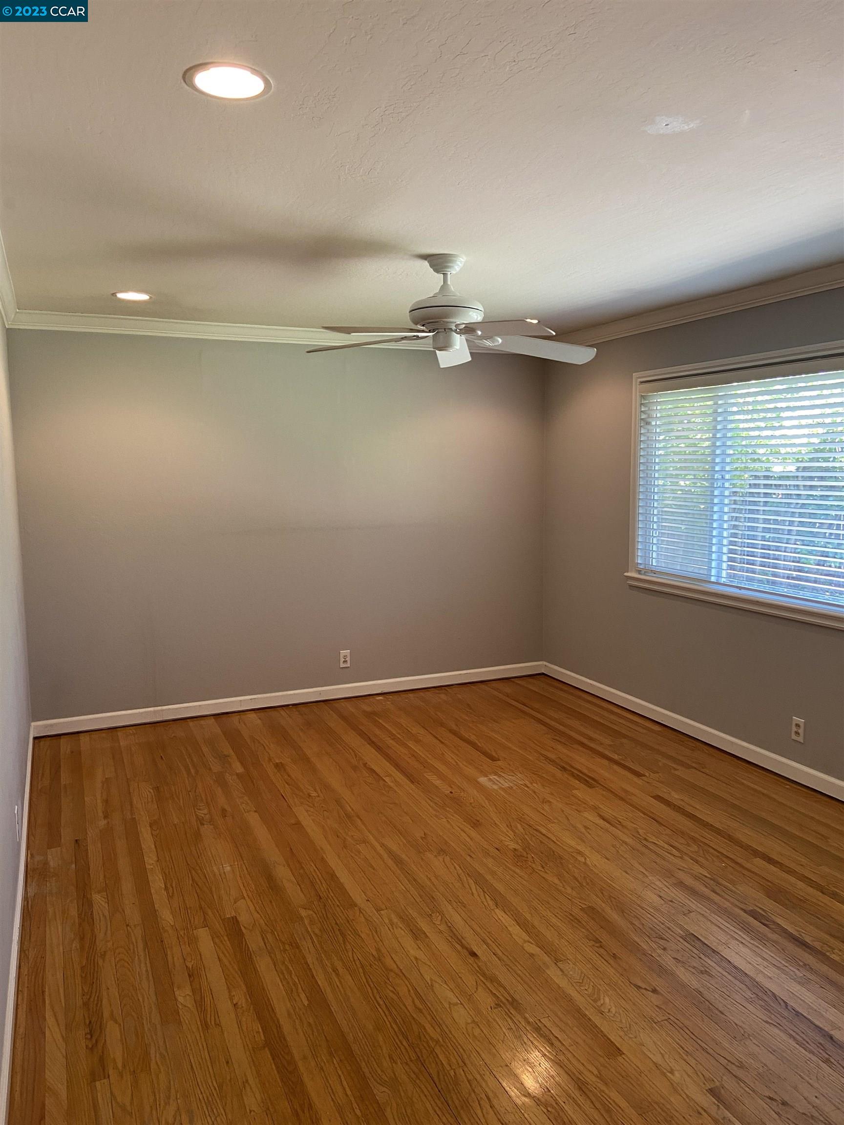 2202 Cascade Drive Walnut Creek, CA 94598 - Photo 12 of 23 wooden floor in an empty room with a window