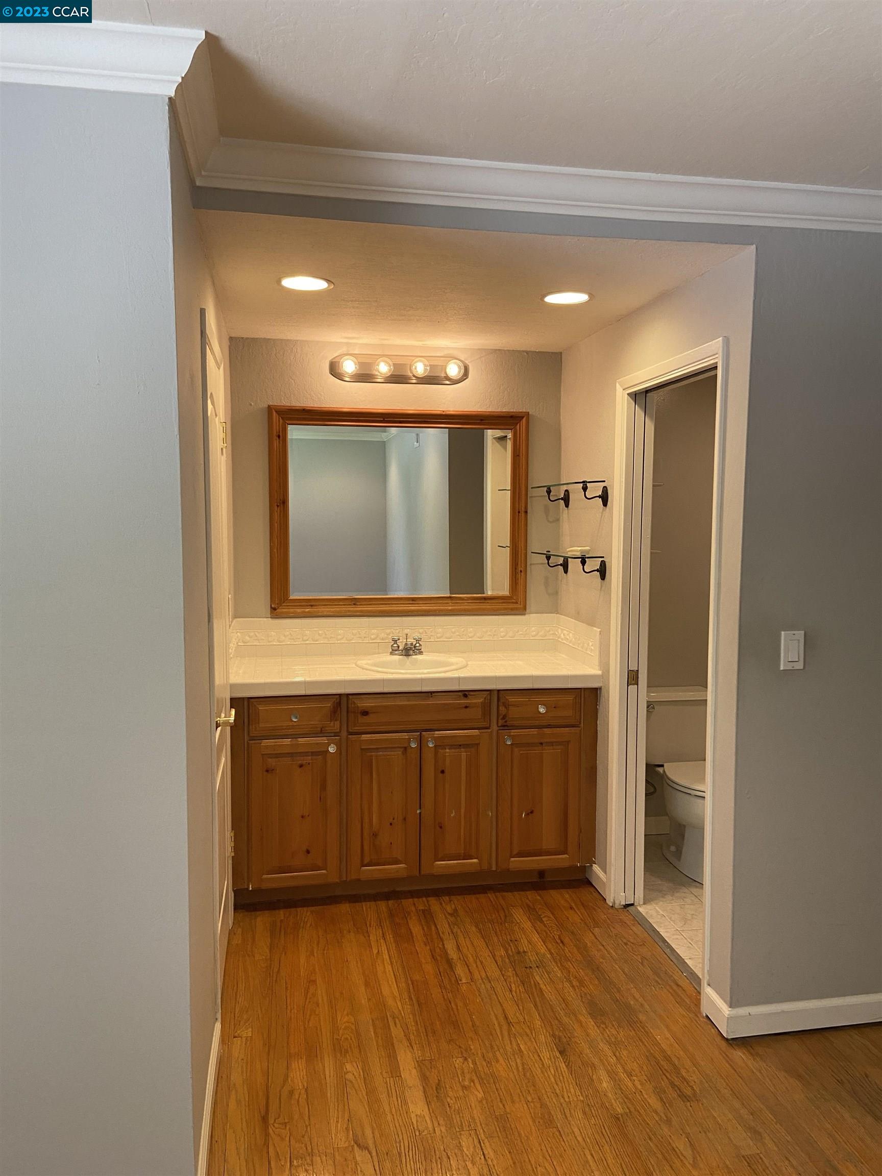 2202 Cascade Drive Walnut Creek, CA 94598 - Photo 13 of 23 a bathroom with a sink a mirror and a bathtub