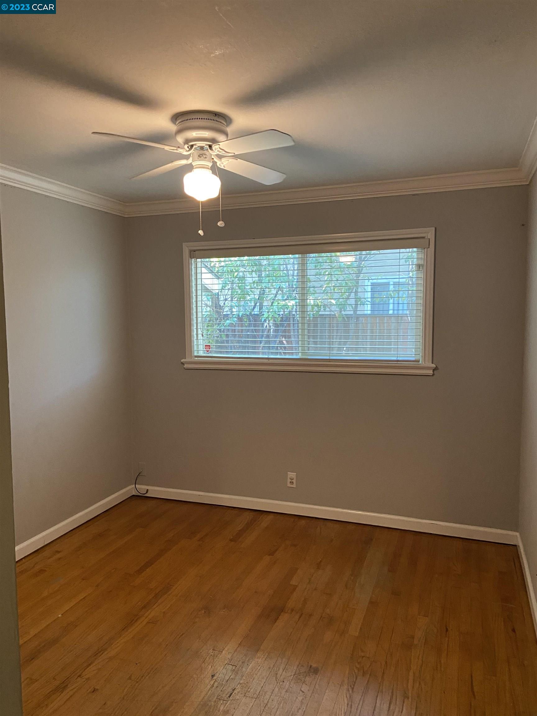 2202 Cascade Drive Walnut Creek, CA 94598 - Photo 17 of 23 a view of an empty room with wooden floor and a window