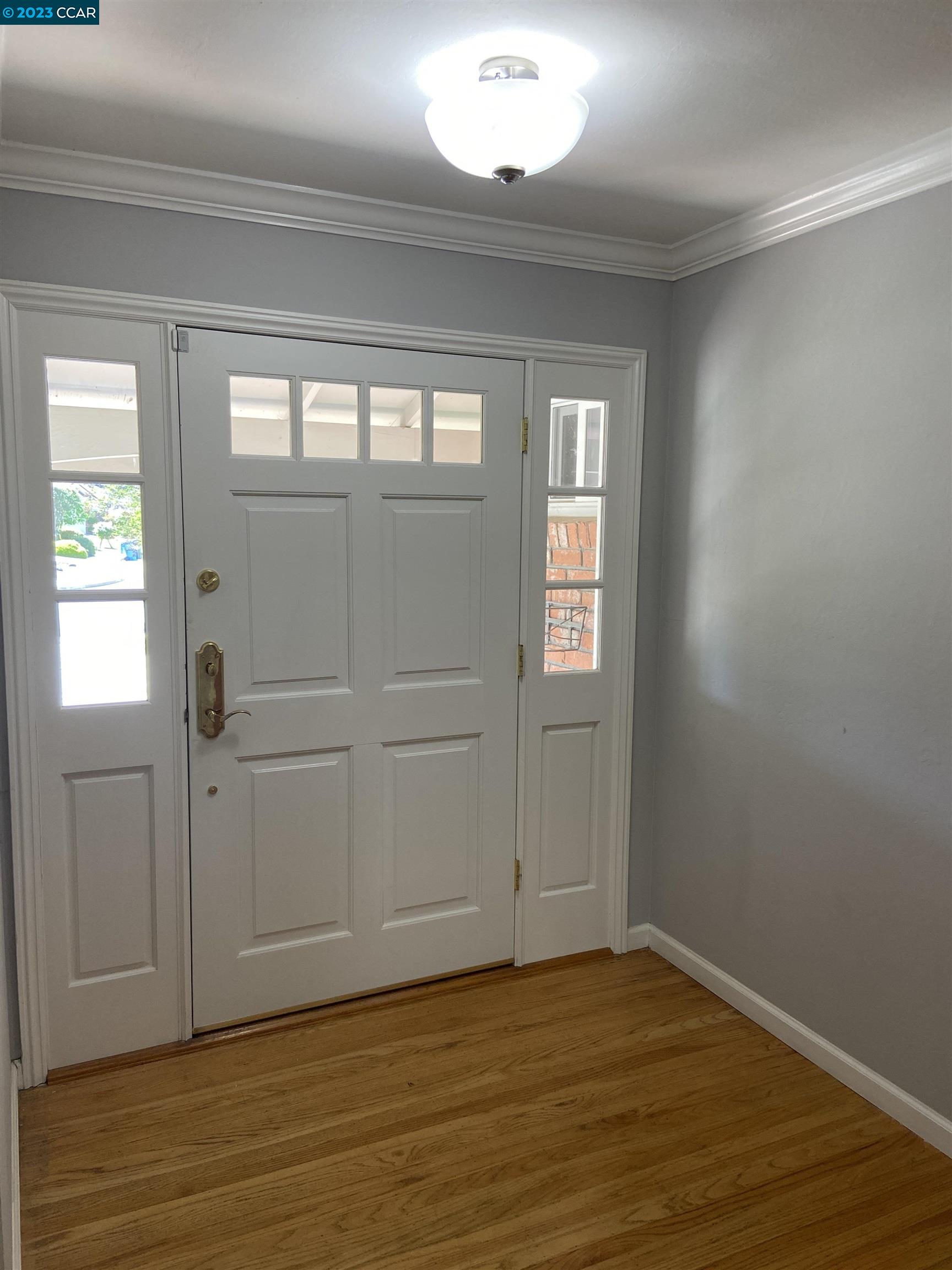 2202 Cascade Drive Walnut Creek, CA 94598 - Photo 2 of 23 a view of an empty room with wooden floor and a window