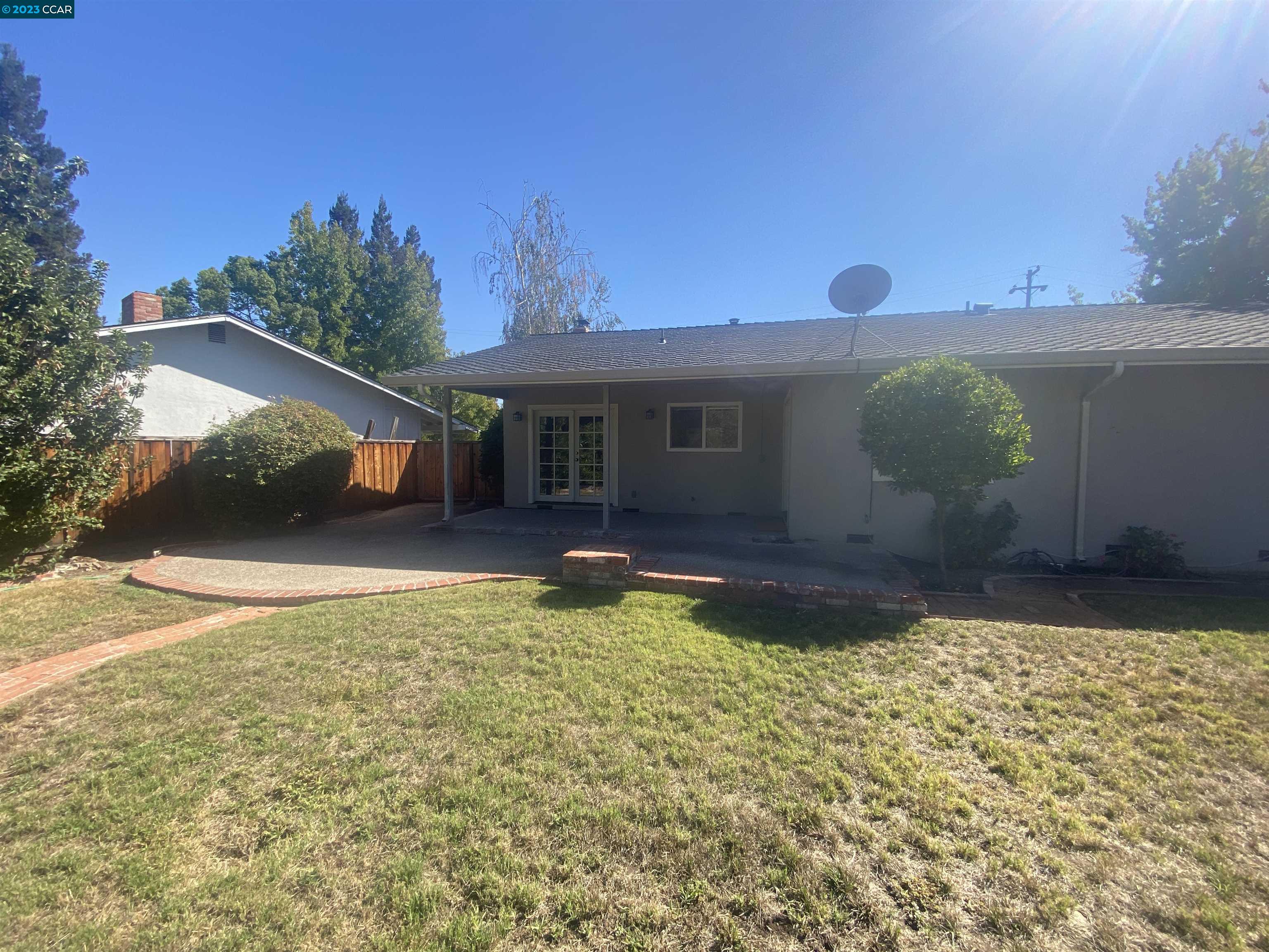 2202 Cascade Drive Walnut Creek, CA 94598 - Photo 23 of 23 a view of a house with backyard and a garden