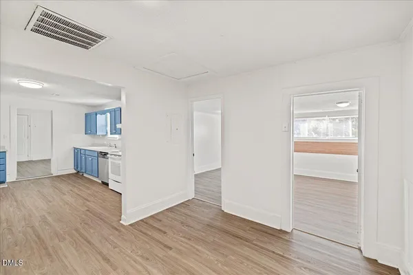 a view of kitchen and white refrigerator