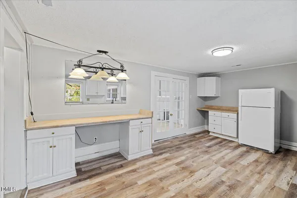 a spacious bathroom with a double vanity sink and a mirror